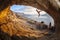 Young woman lead climbing in cave