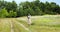 Young woman learning how to pilot her drone in, female using, piloting