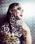 Young woman with leopard make up all over body, cat bodyart