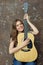 Young woman lifestyle portrait with guitar.