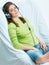 Young woman listening music in headphones.