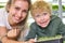 Young woman and a little boy are full of strength and energy, having fun on a micro-green farm.