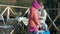 A young woman and a little girl in warm clothes, mother and daughter, had a picnic on the river bank on a wooden bridge