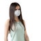 Young woman with long dark hair in a protective medical mask isolated on white background. Coronavirus prevention