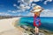 Young woman looking at Agios Prokopios beach of Naxos island, Greece
