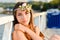 Young woman looking at camera enjoying sunny day on the beach