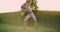 A young woman looking into the cameras performs tilts to the sides for abdominal muscle training.