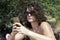 Young woman looking at cellphone on the beach