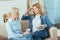 Young woman looking interested while talking to her clever grandmother