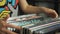 Young woman looking at old vinyl records at flea market