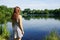 Young woman looking over idyllic lake