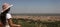 Young woman looking at the panoramic view of the city of Beni Mellal from the Middle Atlas