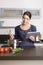 Young woman looking at a recipe on her tablet