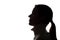 Young woman looking up - horizontal silhouette