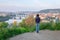 Young woman looking at the Vltava river and bridges of Prague