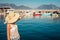 Young woman looks at the Alanya port