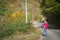 A young woman looks the forest in autumns,