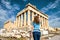 Young woman looks at Parthenon in Athens