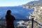 Young woman looks at Sea Cliffs in Tasmania Australia