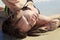 Young woman lounging at the beach