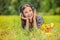 Young woman lying grass headphones fruit