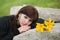 Young woman lying on the tombstone