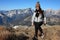 A young woman makes trekking on a mountain