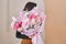 Young woman making fashion modern bouquet in korean style of different flowers. colorful color mix flower. Floral shop