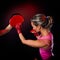 Young woman making a hard punch during training