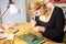 Young Woman Making Jewelry At Home