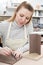 Young Woman Making Pot in Ceramics Studio