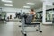 Young woman making torsion exercise in gym