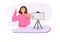 A young woman making a video To create their own business niche. Flat style cartoon illustration vector