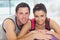 Young woman and man with cropped fitness ball at a gym