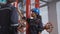 Young woman and man engineer check and examining pipeline and discussion in the factory.