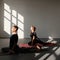 Young woman and man practicing yoga, doing Single Pigeon, Eka Pada Raja Kapotasana exercise, One Legged King Pigeon pose.