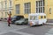 Young woman in mask and man crosses the road. Empty streets in the centre of the city on 1st day of self isolation