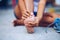 Young woman massaging her painful foot from exercising