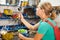 Young woman mechanic measuring air pressure