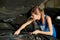 Young woman mechanics repairing or inspecting a car