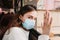 Young woman in medical mask stay isolation at home for self quarantine