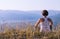 Young woman meditated on the top of mountain