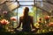 Young woman meditating in beautiful garden, yoga in summer greenhouse