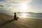 Young woman meditating in the Sanur beach