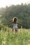 Young woman meditating in a serene meadow