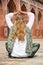 Young woman meditating in the yard of Humayun\'s Tomb. Delhi