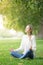 Young woman meditating and Yoga in a park