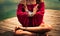 Young woman in a meditative yoga position outdoor