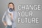 Young woman with megaphone and phrase CHANGE YOUR FUTURE on background. Career promotion