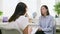 Young woman at mental therapy, talking to female psychologist